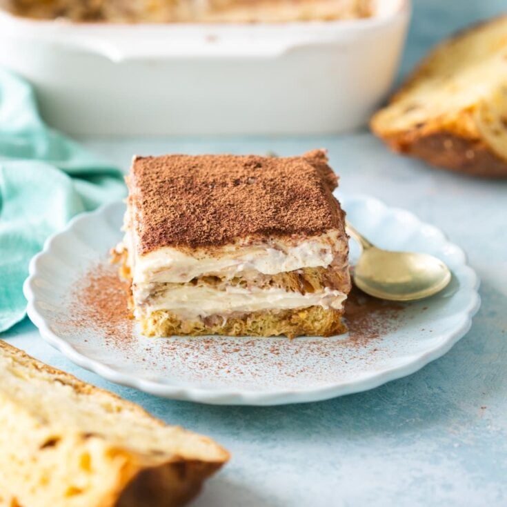 A large piece of Christmas tiramisu on a white plate.